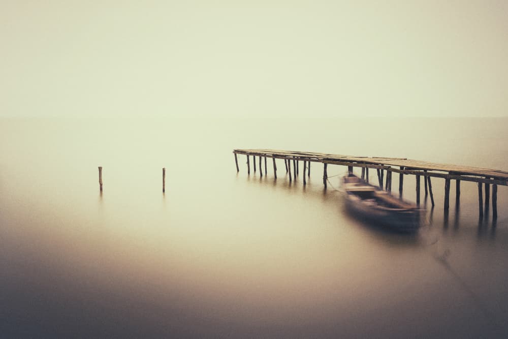 Serene Dock and Boat by Anghel Rusu — canvas wall art