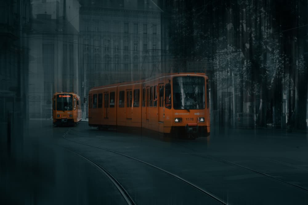 Orange Trams in Motion by Rob Li — canvas wall art