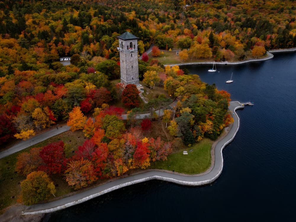 Historic Tower Autumn Lake by Ambar Saha — canvas wall art