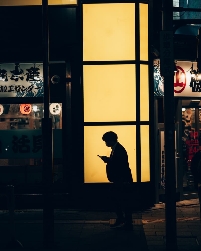 City Night Phone Glow by Alexander London — canvas wall art
