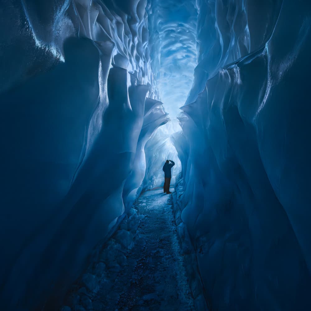 Blue Ice Cave Explorer by Leah Xu — canvas wall art