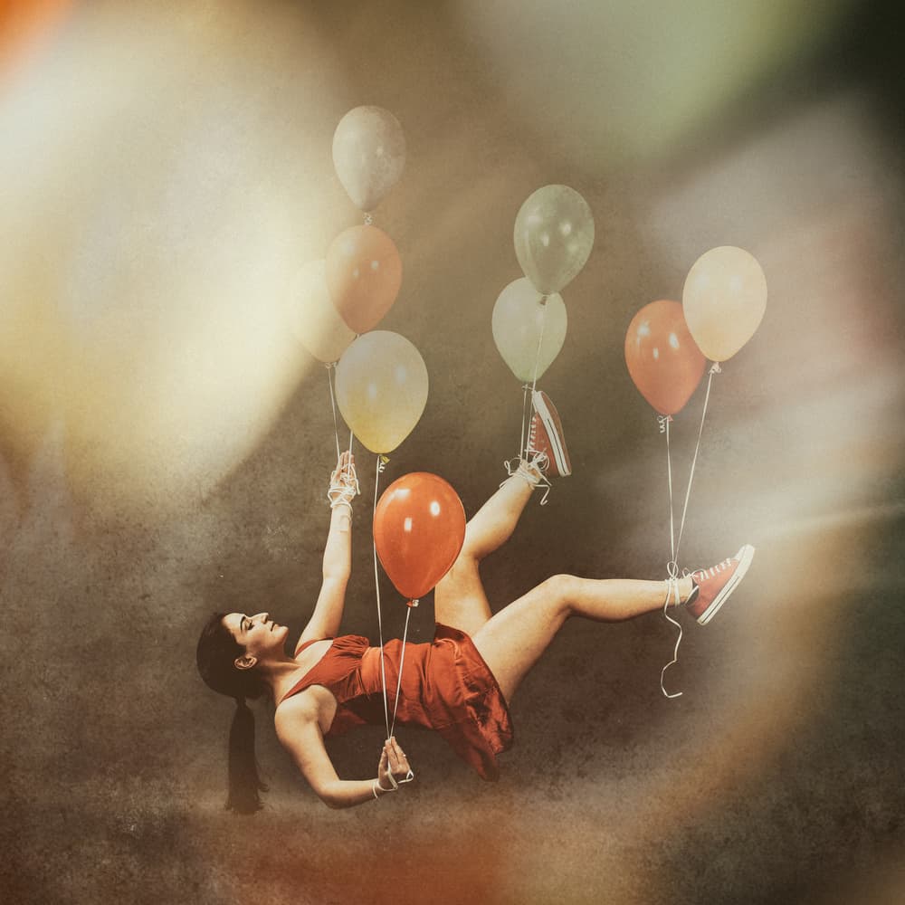 Floating Dreamer with Balloons by Stefan Kamenov — canvas wall art