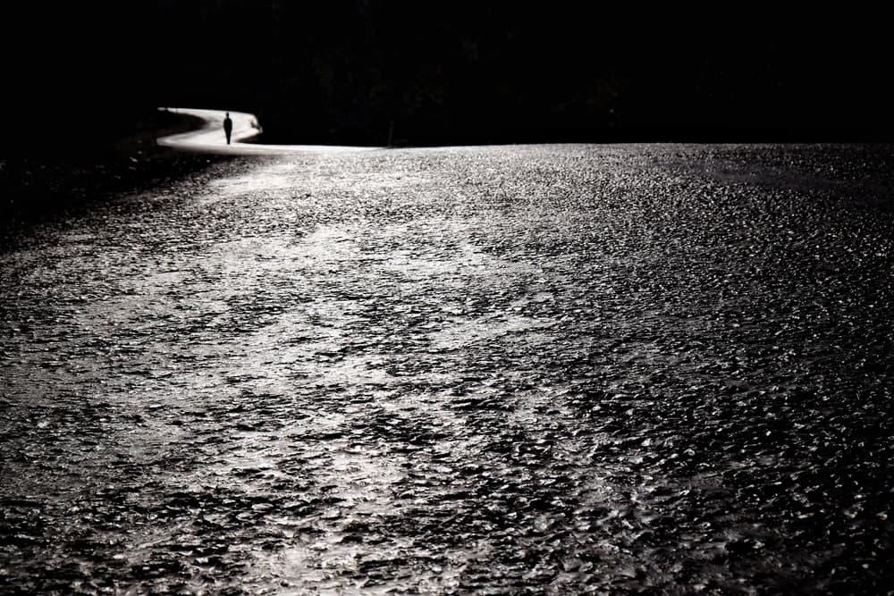 Lone Figure on Wet Road by Ali Ayer — canvas wall art