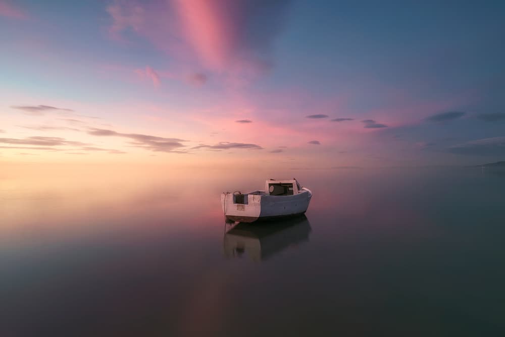 Calm Water Sunset Boat by joanaduenas — canvas wall art