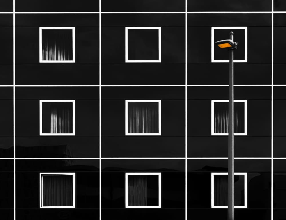 Black Building Orange Light by Hans-Wolfgang Hawerkamp — canvas wall art