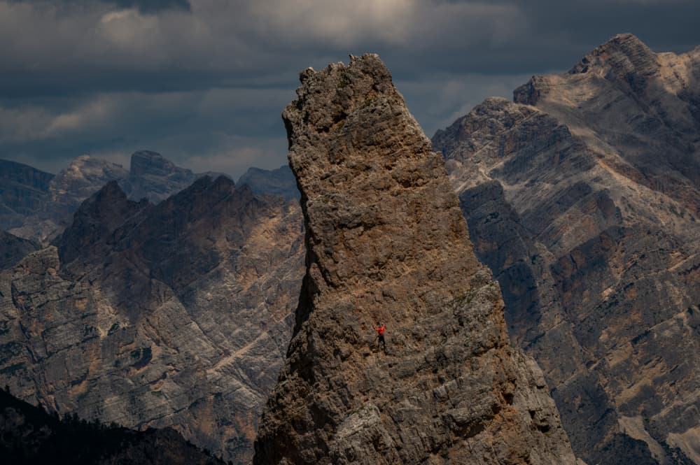 Climber Scales Dolomite Peak by Guy Wilson — canvas wall art