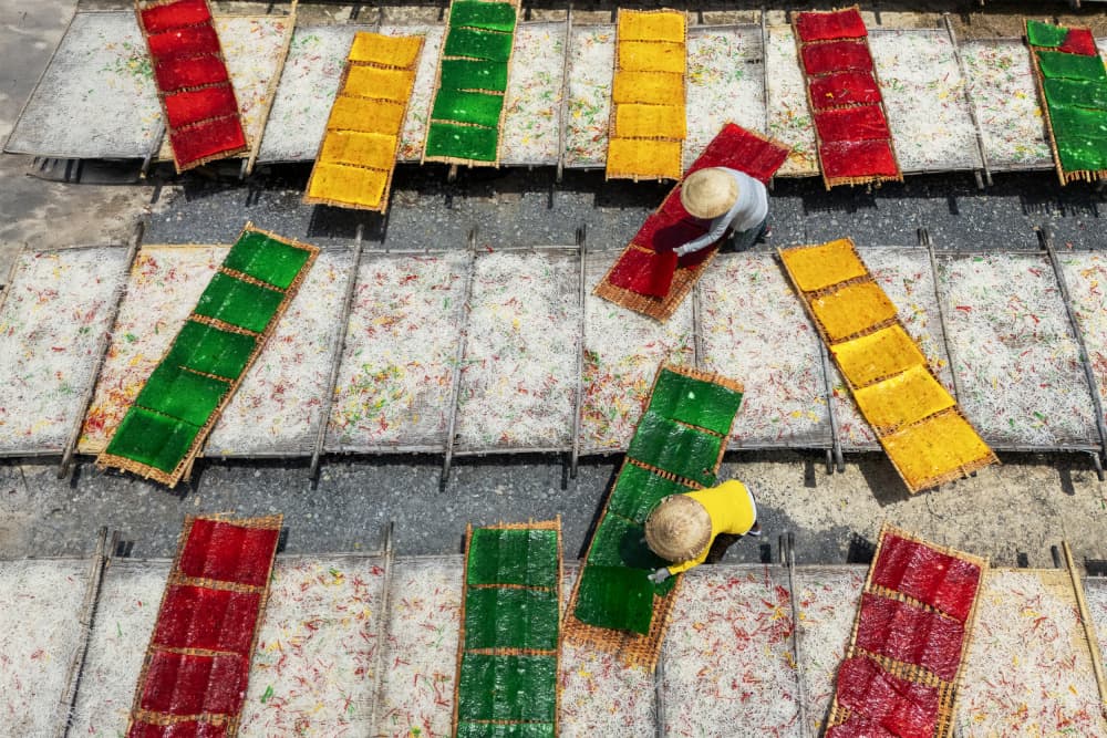 Workers Drying Colorful Sweets by Sally Widjaja — canvas wall art