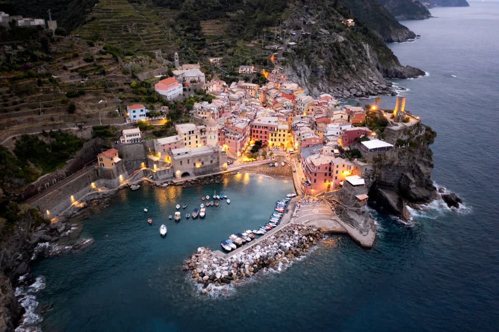 Colorful Coastal Village Evening by Ashley Sowter — canvas wall art