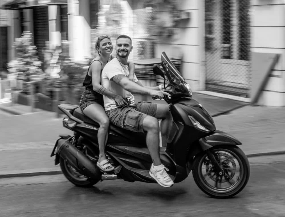 Happy Couple Scooter Ride by Itzik Einhorn — canvas wall art