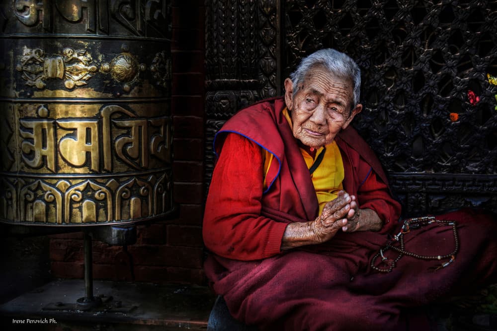 Buddhist Woman Prayer Wheel by Irene Perovich — canvas wall art