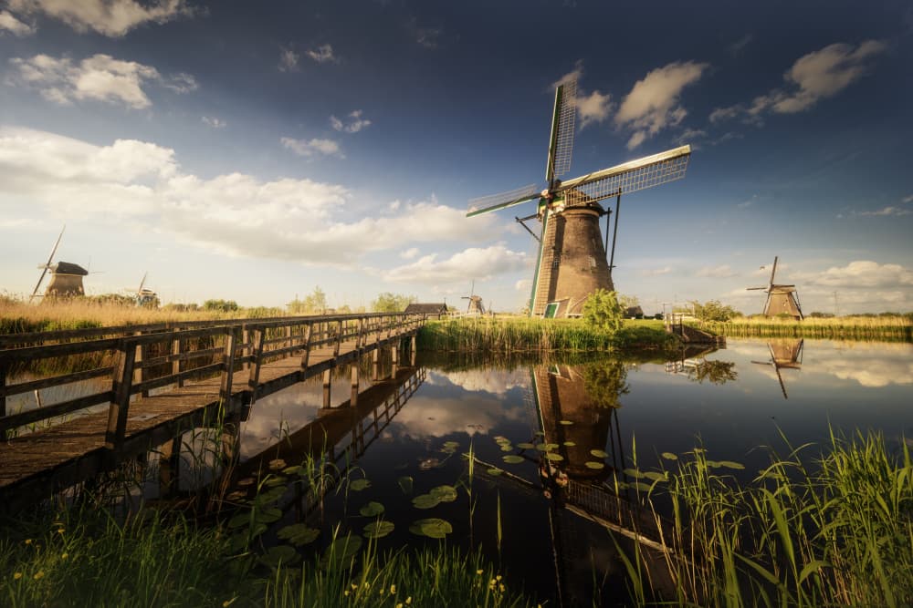 Dutch Windmills Reflection by Alberto Alvaro — canvas wall art