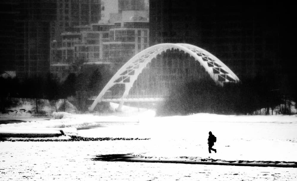 Lone Figure Winter Bridge by Jian Wang — canvas wall art