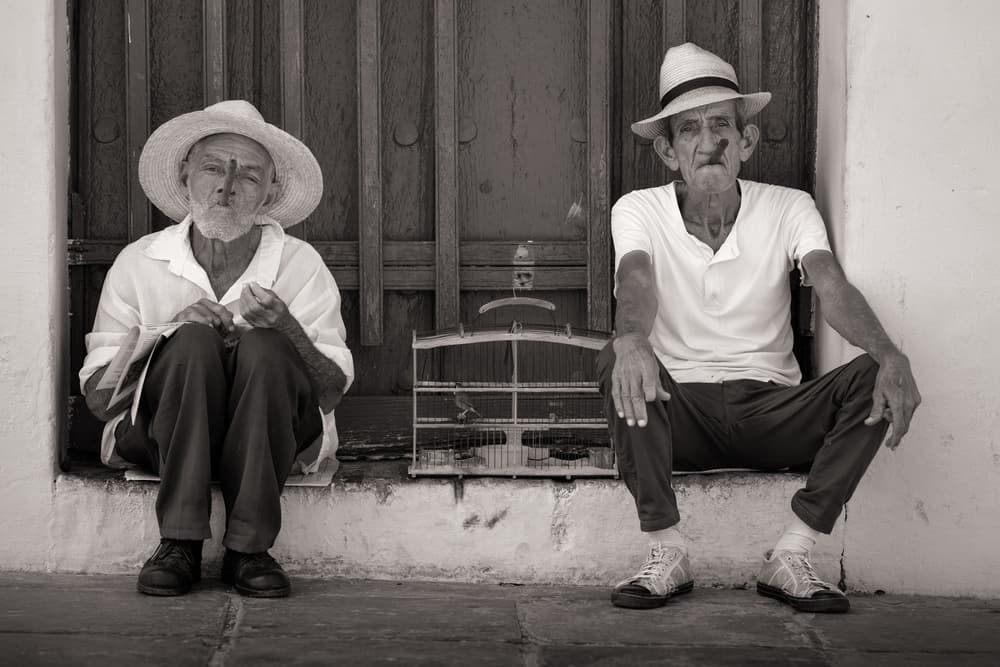 Street Side Cigar Smokers by Karen Deakin — canvas wall art