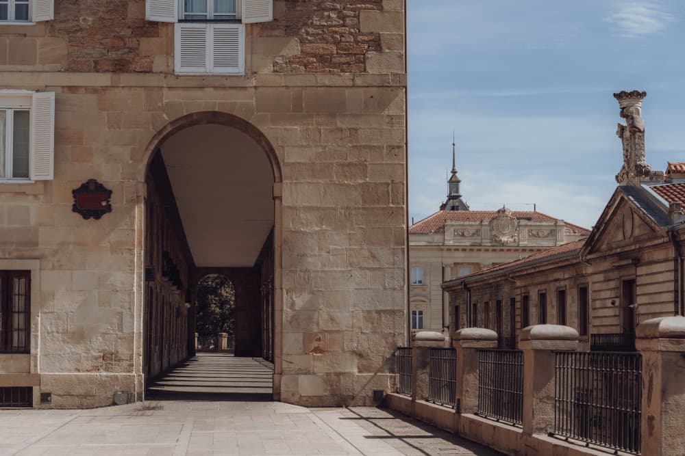 Stone Archway Leading Through the Old Town in Sand & Sky, Vitoria-Gasteiz, Spain by Aimee Giles — canvas wall art