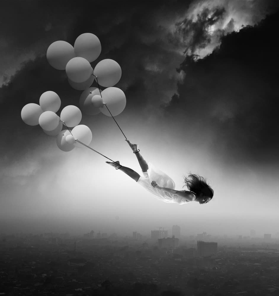 Floating Dream Over City by Hari Sulistiawan — canvas wall art