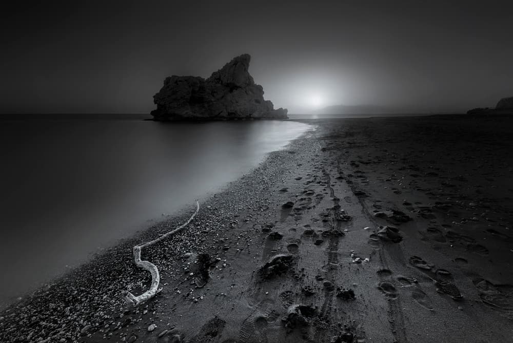 Moody Coastal Rock by Joaquin Guerola — canvas wall art
