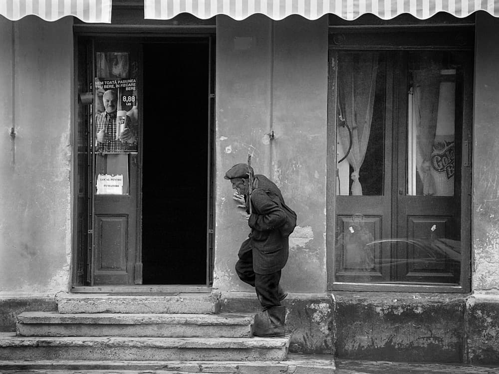 Street Man Leans by Nicoleta Gabor — canvas wall art