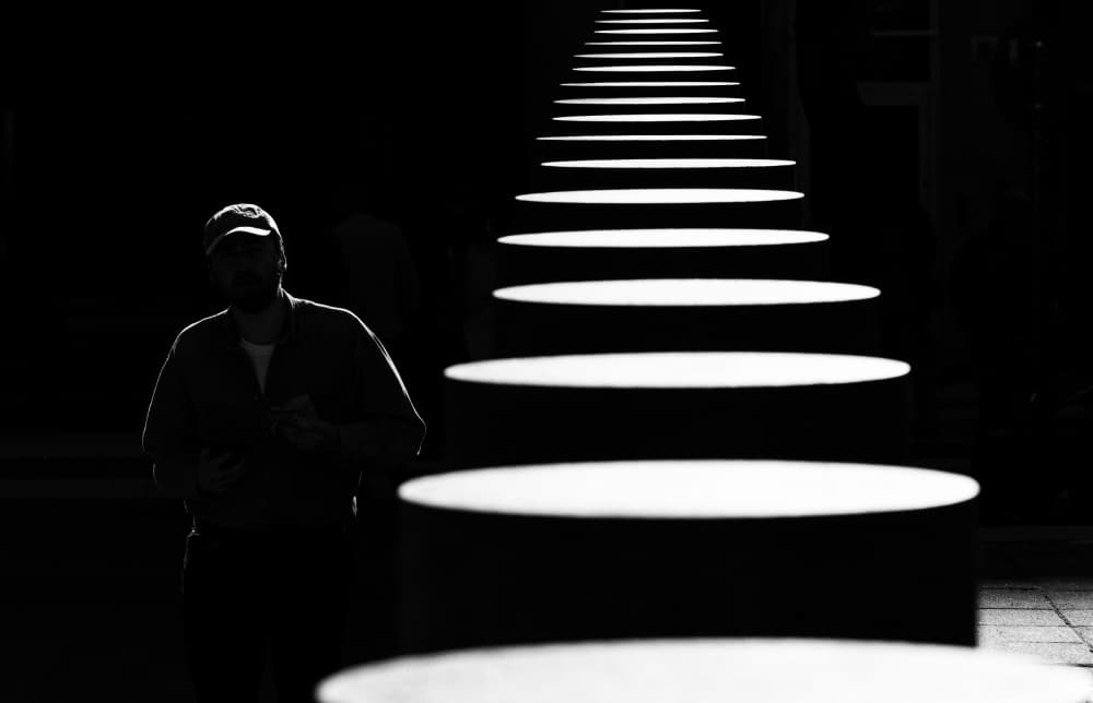 Man on Illuminated Path by Karim Al Thahaby — canvas wall art
