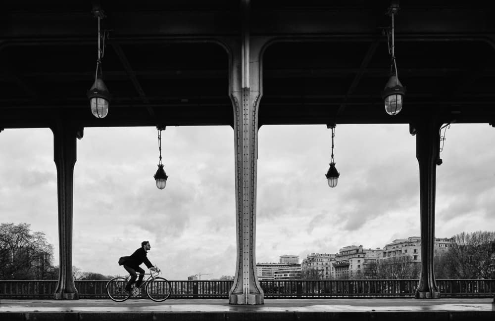Urban Cyclist Under Bridge by Magdalena Roeseler — canvas wall art