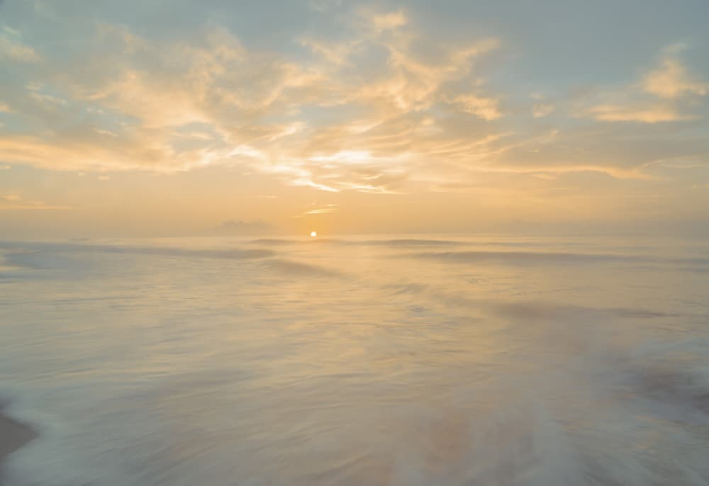 Misty Beach Sunrise by Courtney Crane — canvas wall art