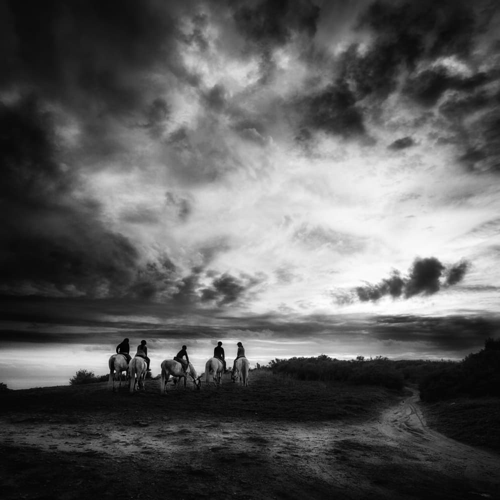 Riders Under Dramatic Sky by Juan Marín Gómez — canvas wall art