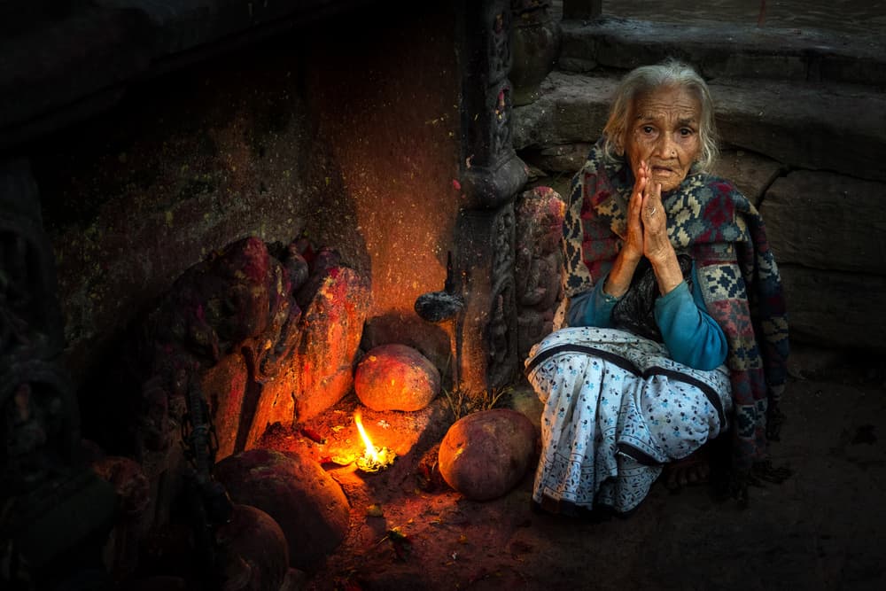 Elderly Woman Praying by Ali Khataw — canvas wall art