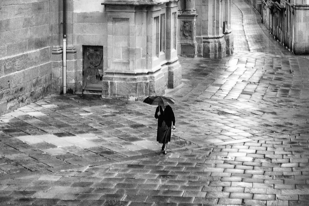 Elegant Rainy City Walk by Michel Groleau — canvas wall art