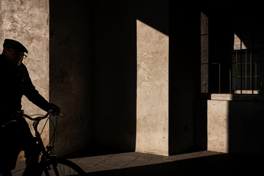 Man Through Sunlit Passage by Luca Domenichi — canvas wall art
