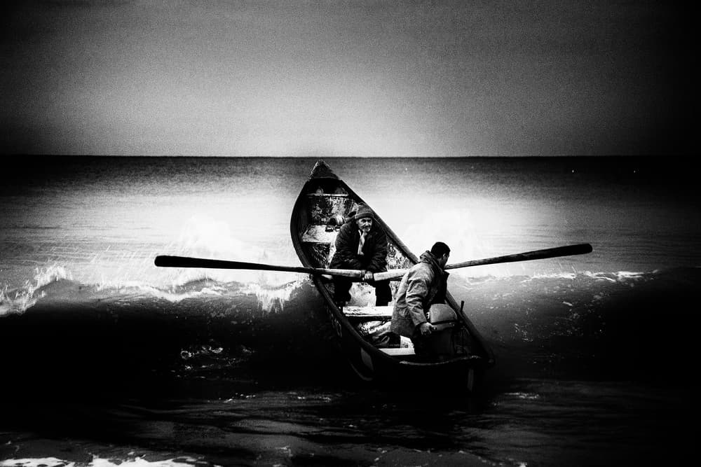 Two Men Rough Sea by Elena Raceala — canvas wall art