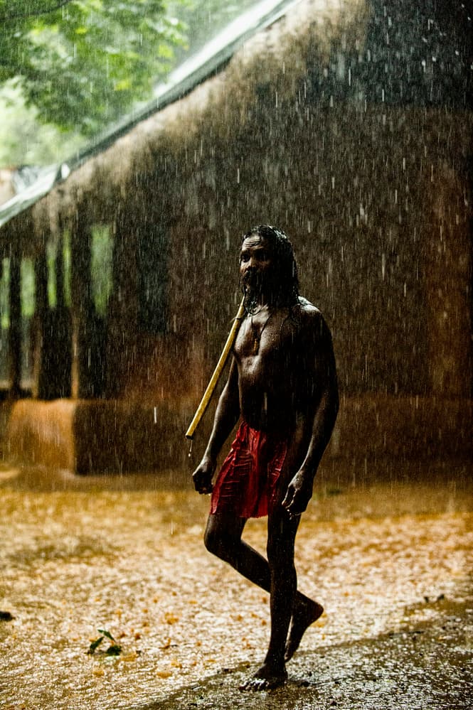 Man Walking In Monsoon by Gina Buliga — canvas wall art