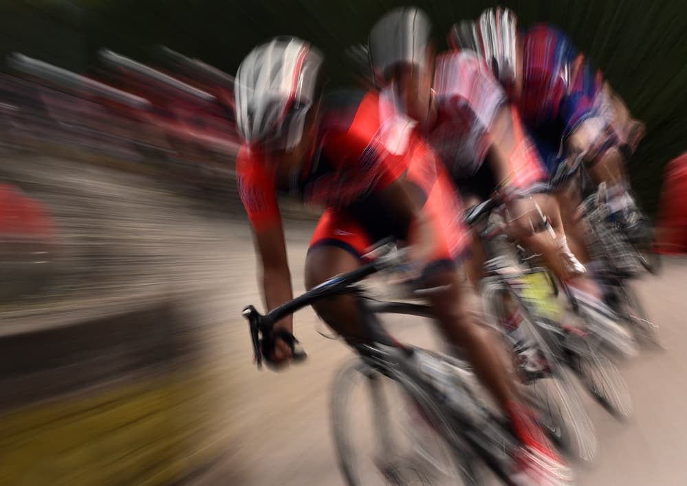 Racing Cyclists Blur by Lou Urlings — canvas wall art