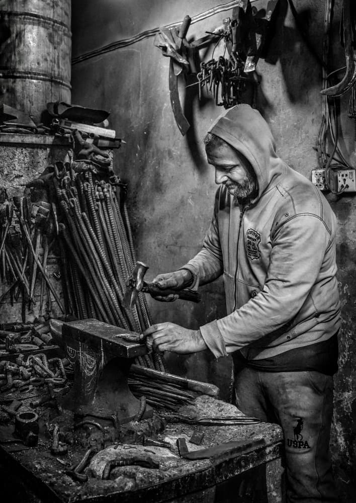 Artisan At Anvil by Bashar Alsofey — canvas wall art