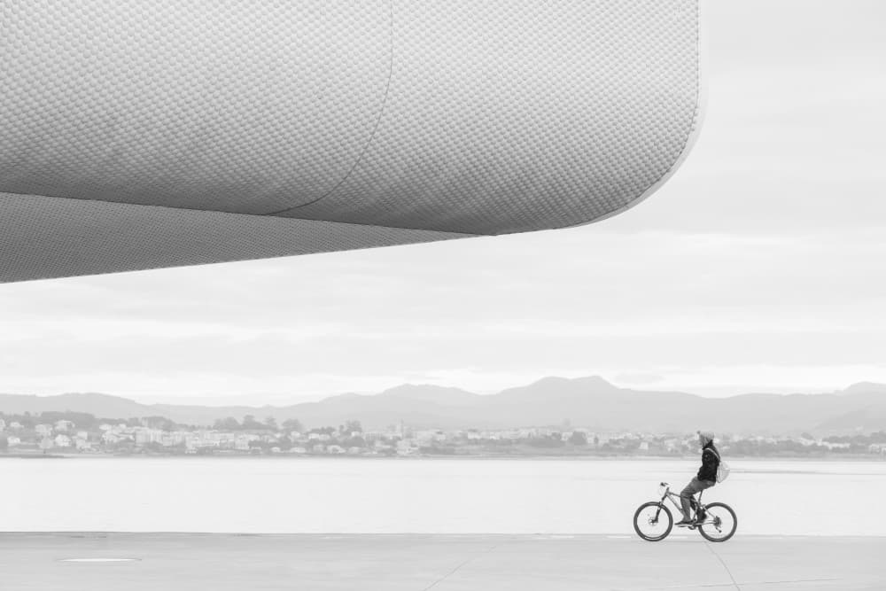 Modern City Cyclist by Oskar Baglietto — canvas wall art