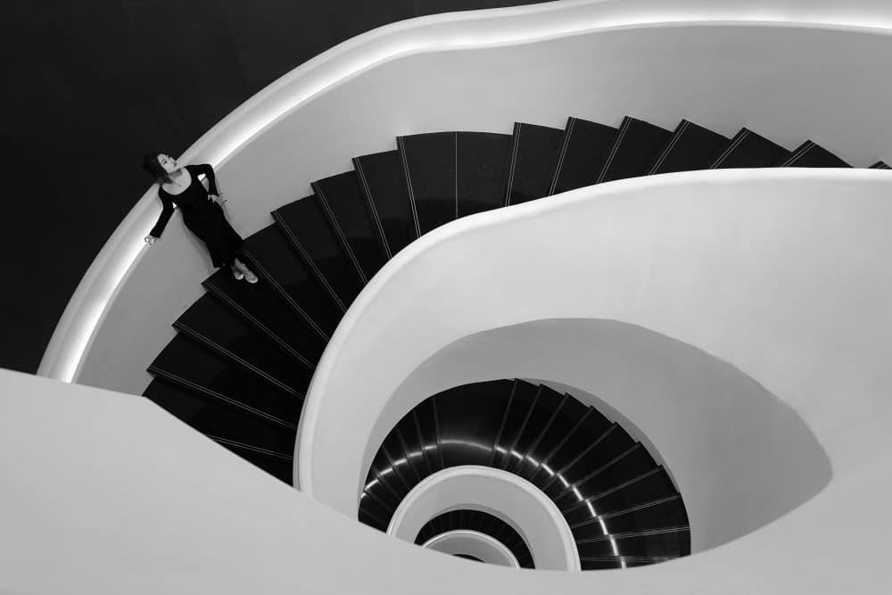 Woman on Spiral Staircase by Mei Xu — canvas wall art