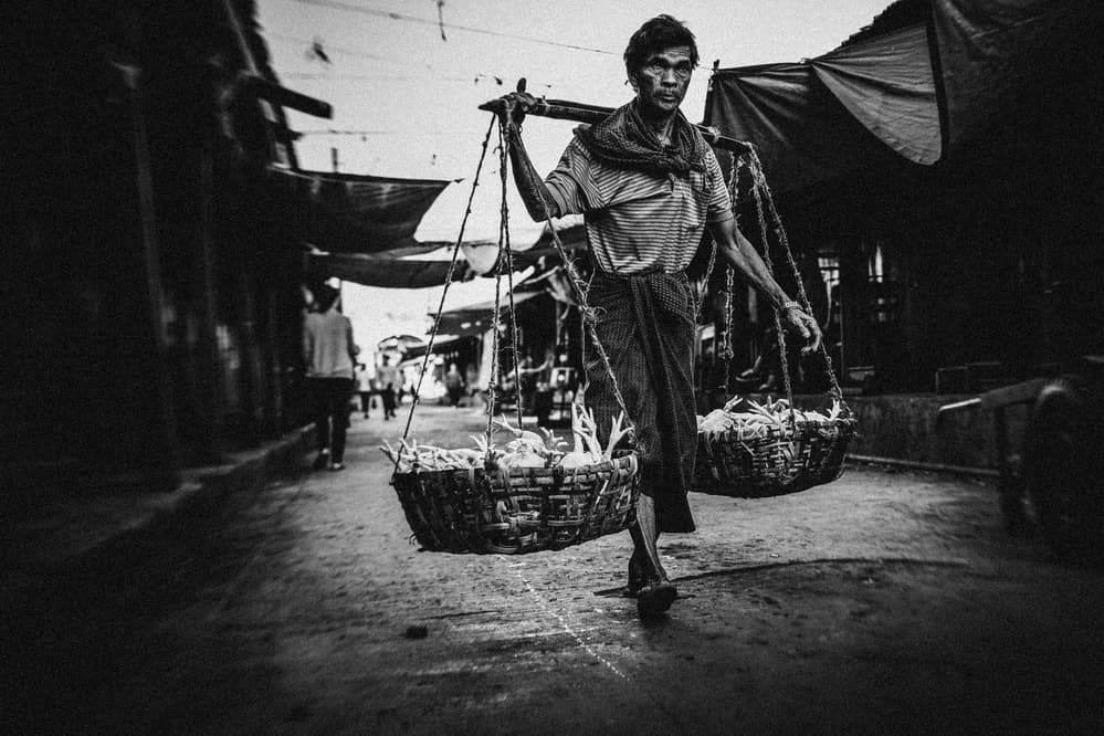 Street Market Vendor by ADIREK M — canvas wall art