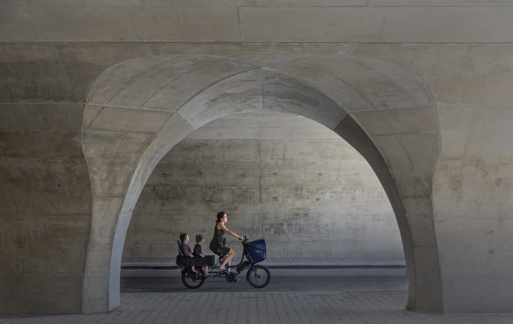 Cycling Family Under Arch by Jef Van den Houte — canvas wall art