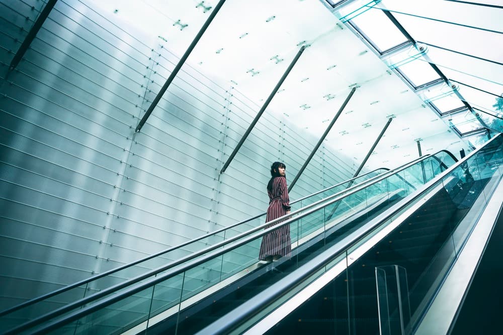Woman On Modern Escalator by 7 Flavor C/P — canvas wall art