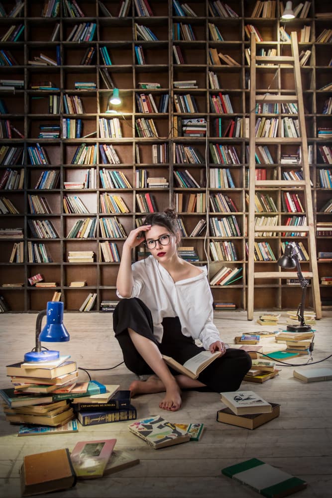 Thoughtful Library Reading by Mykola Lebediev — canvas wall art