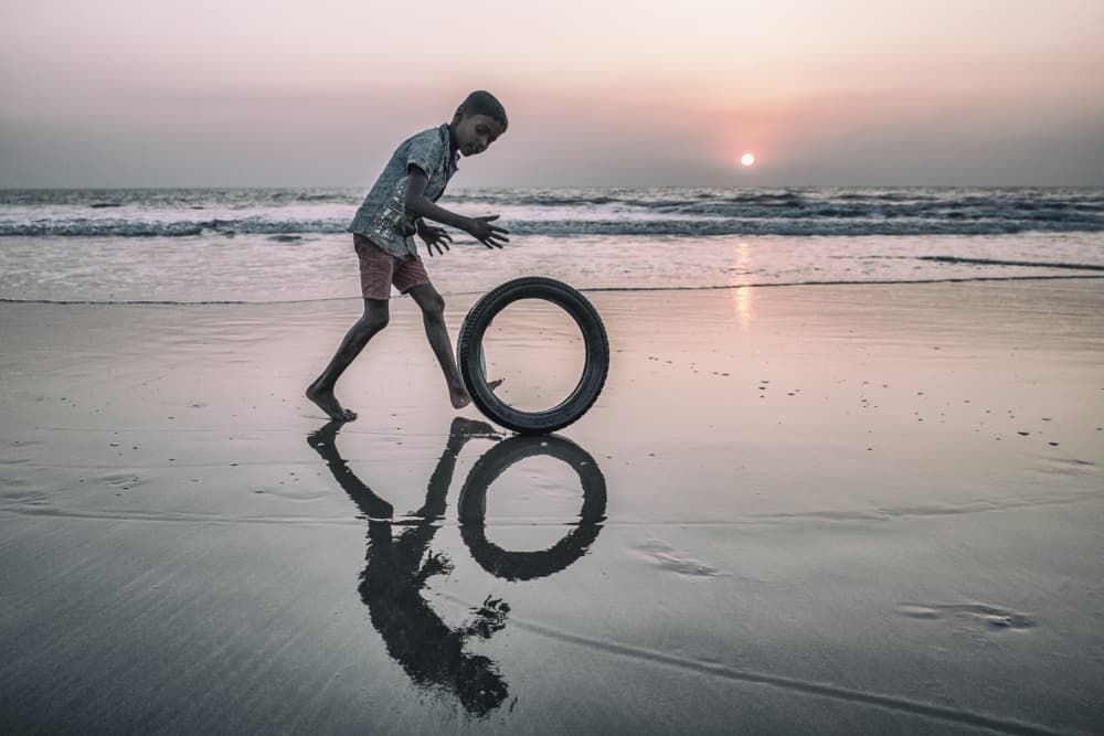 Sunset Beach Boy Play by Marcel Rebro — canvas wall art