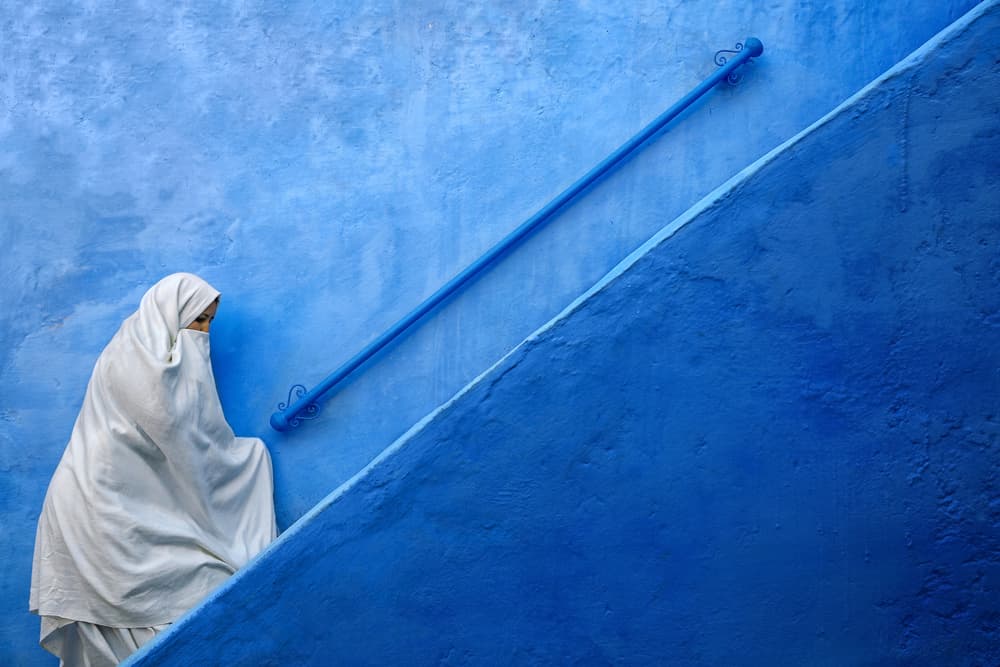 Woman on Blue Steps by Fadhel Almutaghawi — canvas wall art