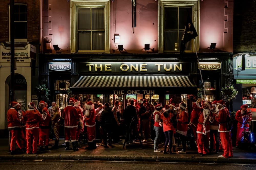 Santas Outside London Pub by Walde Jansky — canvas wall art