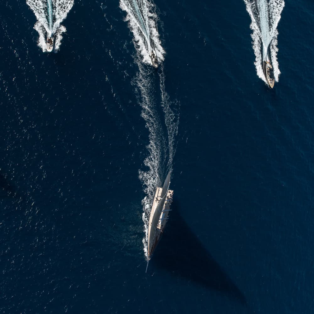 Sailing Yacht and Speedboats by Marc Pelissier — canvas wall art