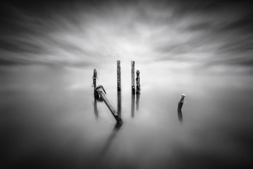 Moody Water Posts by Joaquin Guerola — canvas wall art