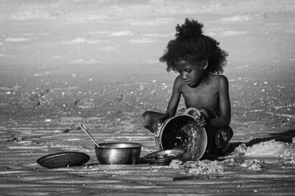 African Child Cooking by António Carreira — canvas wall art