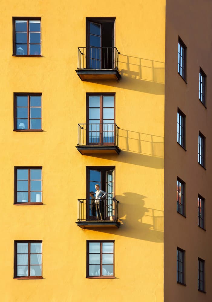 Man on Yellow Balcony by Karim Al Thahaby — canvas wall art