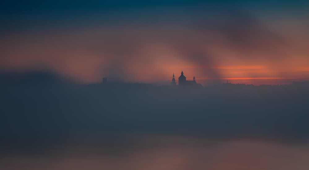 Sunrise Over Foggy City by Wojciech Łączkowski — canvas wall art