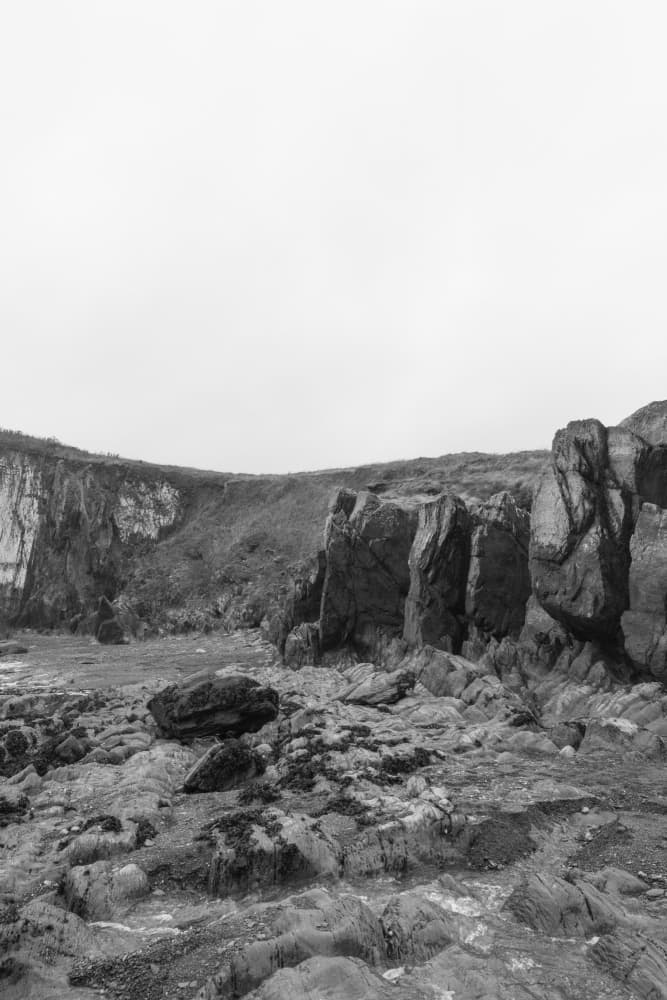 Monochrome Rocky Coast by Lynann Colligan — canvas wall art