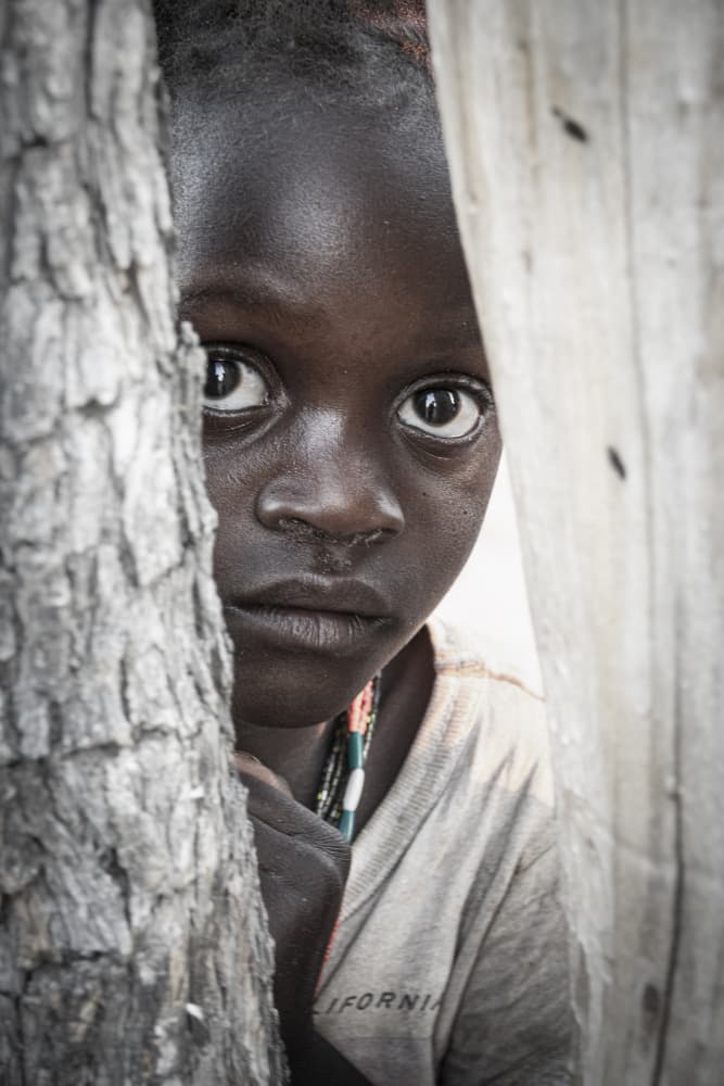 Curious Child's Gaze by Elena Molina — canvas wall art