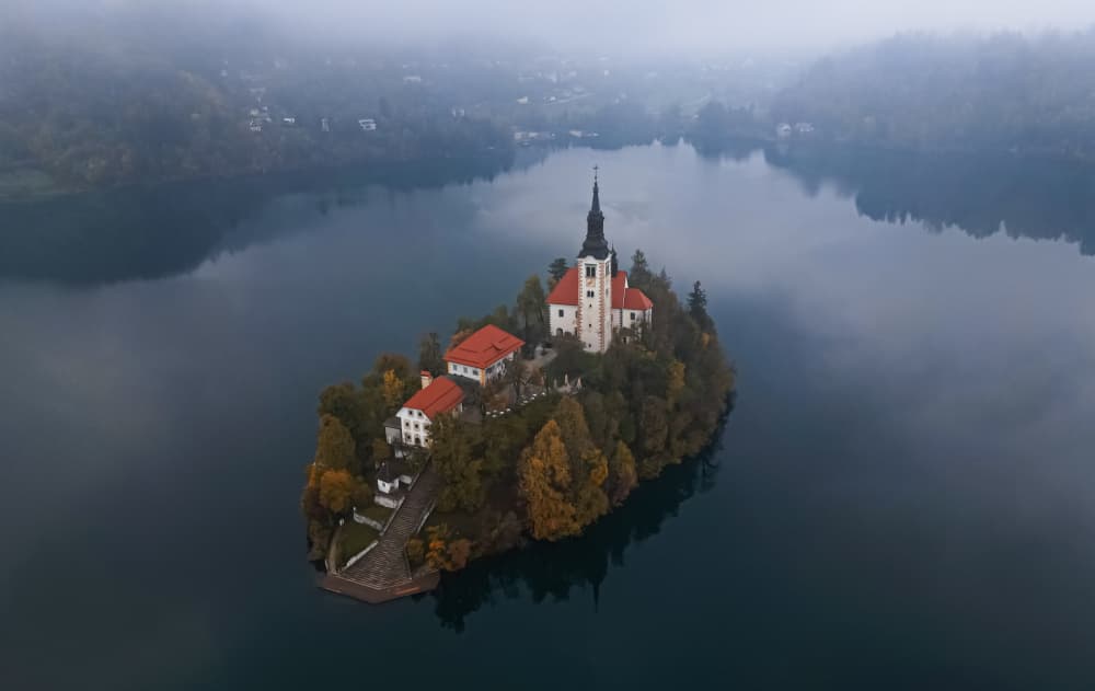 Misty Lake Bled Island by Yanny Liu — canvas wall art