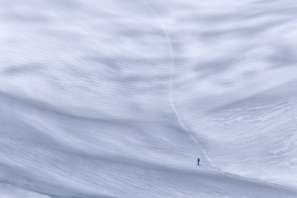 Solitary Winter Trek by Uschi Hermann — canvas wall art